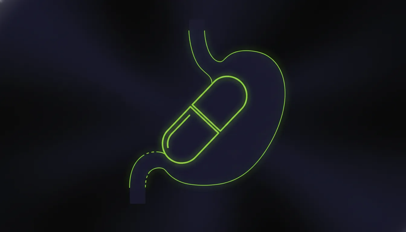 A minimalist representation of a drug capsule and stomach silhouette in dark colors.